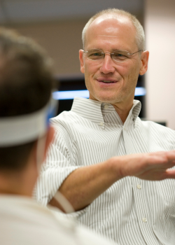 tony babb working with a subject in the research lab